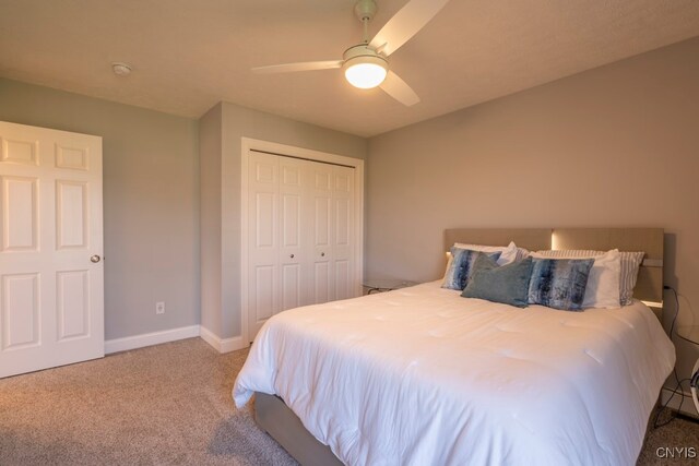 bedroom with carpet, ceiling fan, and a closet