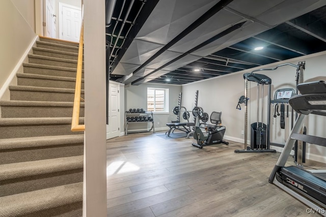 exercise area featuring hardwood / wood-style floors