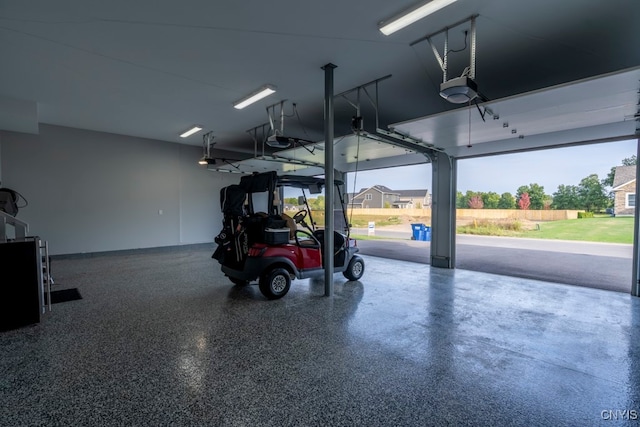 garage featuring a garage door opener