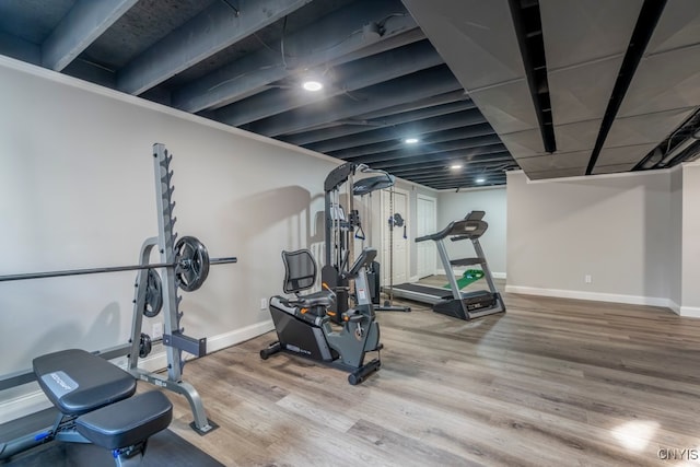 exercise room featuring wood-type flooring