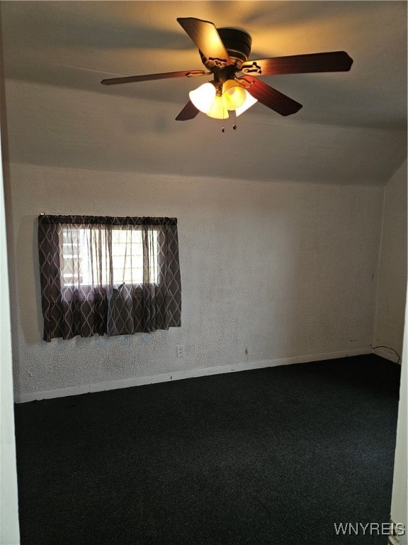 carpeted empty room with ceiling fan