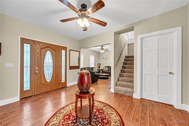 foyer entrance featuring ceiling fan and hardwood / wood-style floors