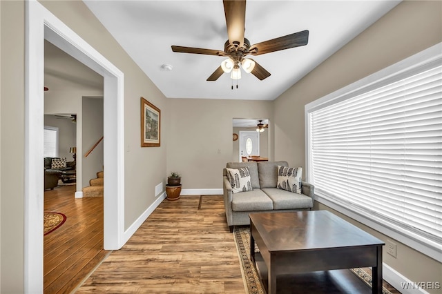 interior space with light wood-type flooring and ceiling fan