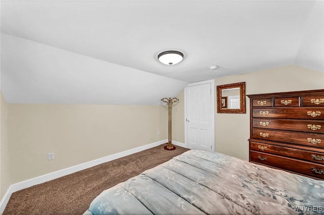 carpeted bedroom featuring vaulted ceiling