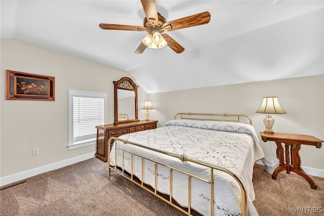 bedroom with ceiling fan, carpet flooring, and vaulted ceiling