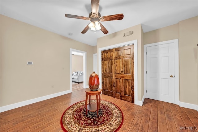 bedroom with ceiling fan and hardwood / wood-style flooring