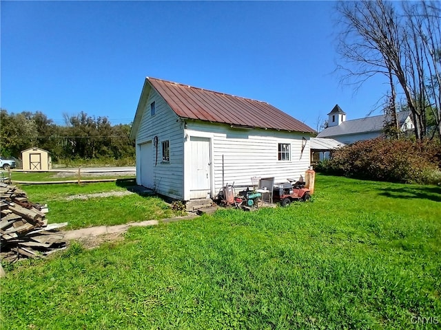 view of outdoor structure featuring a yard