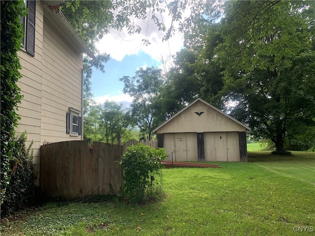 exterior space featuring wood walls and a lawn