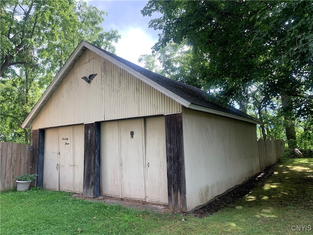 view of outdoor structure featuring a lawn