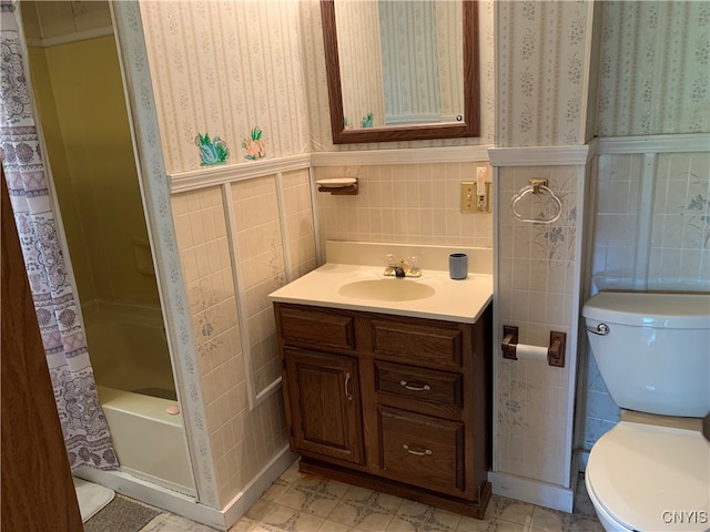 full bathroom featuring shower / bath combination with curtain, vanity, tile walls, and toilet