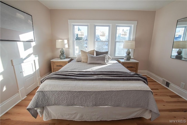 bedroom with light hardwood / wood-style flooring