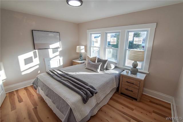 bedroom with light hardwood / wood-style flooring