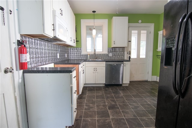 kitchen with hanging light fixtures, white cabinets, backsplash, dishwasher, and black refrigerator with ice dispenser