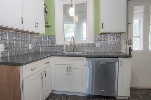 kitchen featuring white cabinets, dishwasher, backsplash, and sink