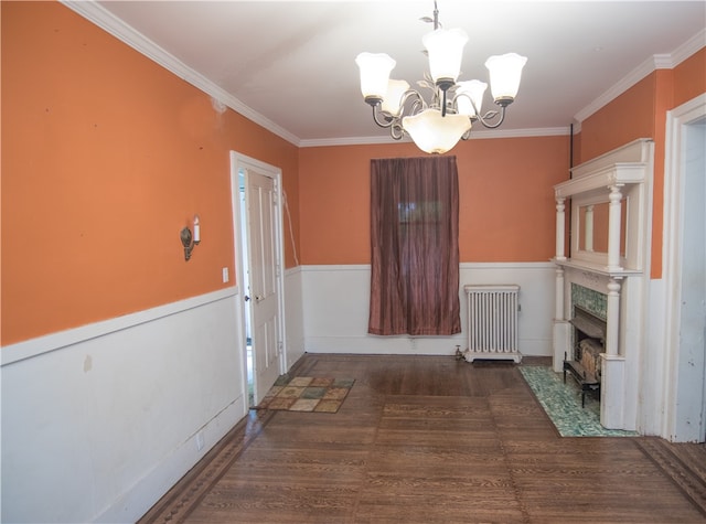 hall with ornamental molding, radiator, dark wood-type flooring, and a chandelier