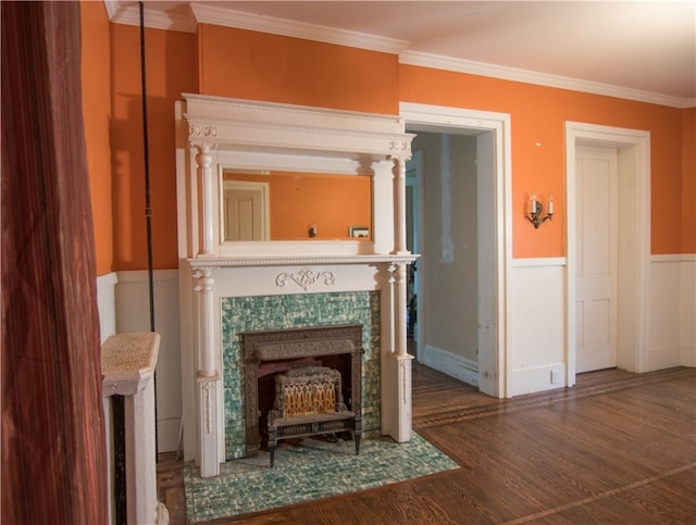 unfurnished living room with ornamental molding and dark hardwood / wood-style flooring