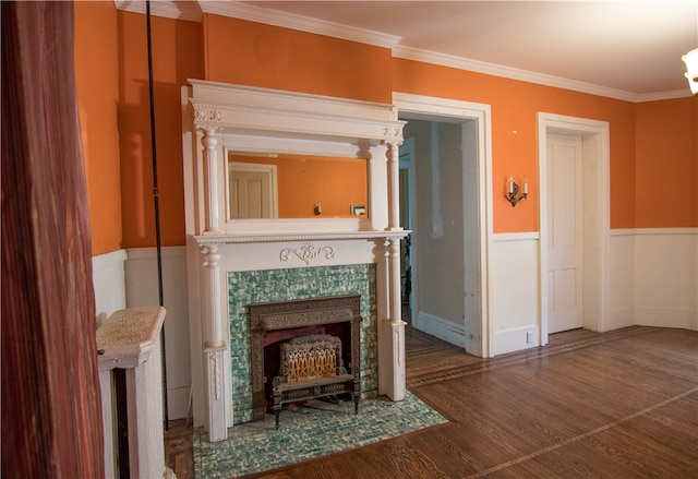 unfurnished living room with ornamental molding and dark hardwood / wood-style floors