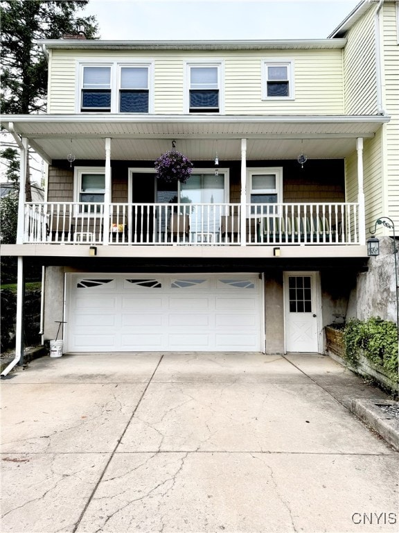 view of front of property with a garage and covered porch