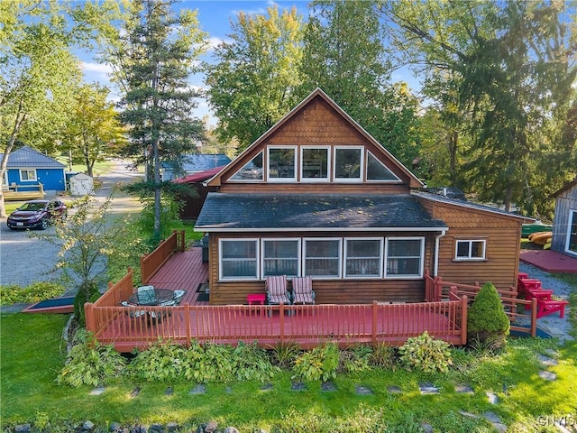 back of house featuring a deck