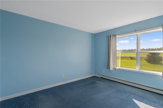 carpeted empty room featuring a baseboard radiator