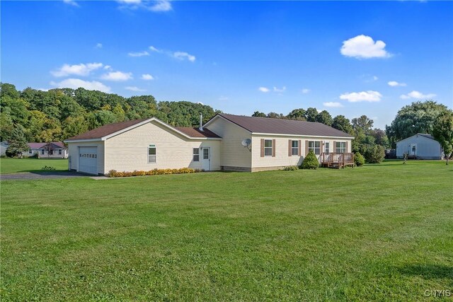 exterior space featuring a front lawn and a garage