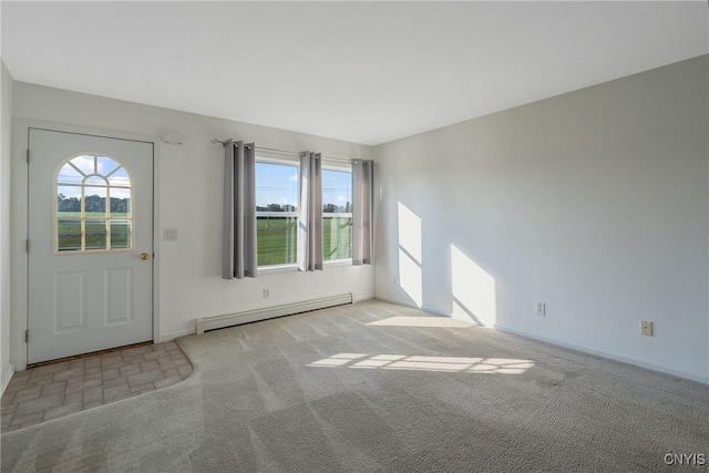 foyer entrance featuring light carpet and a baseboard heating unit