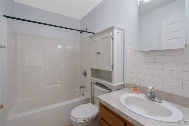 full bathroom featuring tasteful backsplash, vanity, bathtub / shower combination, and toilet