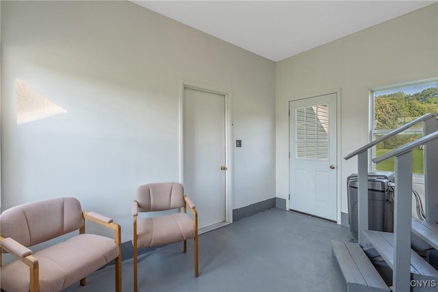 living area featuring concrete floors