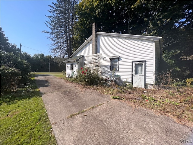 view of property exterior featuring a yard