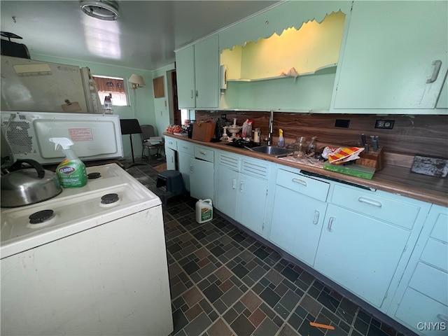 kitchen featuring white cabinets, white appliances, and sink