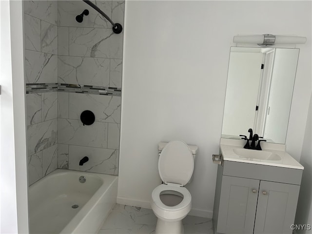 full bathroom featuring tiled shower / bath, vanity, and toilet