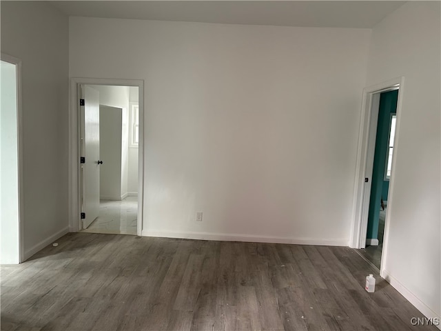 unfurnished room featuring dark hardwood / wood-style floors