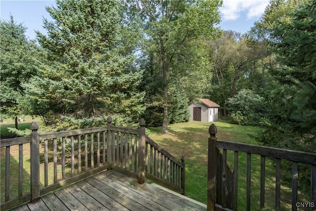 wooden deck featuring a storage shed and a yard