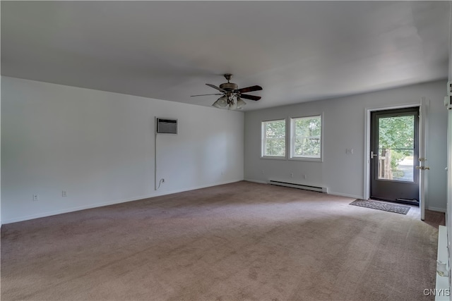 carpeted spare room featuring an AC wall unit, baseboard heating, and ceiling fan