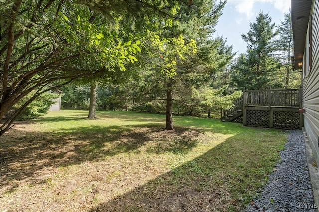 view of yard with a deck