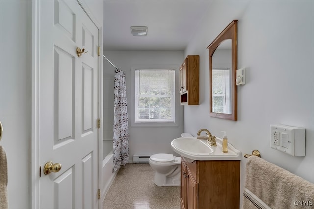 full bathroom with baseboard heating, shower / bath combo, vanity, and toilet