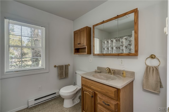 bathroom featuring baseboard heating, vanity, and toilet