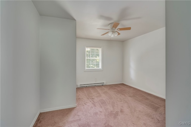 spare room with a baseboard radiator, ceiling fan, and light colored carpet