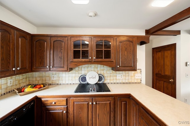 kitchen featuring black appliances and tasteful backsplash