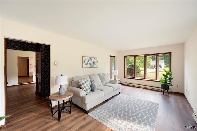 living room with baseboard heating and hardwood / wood-style floors