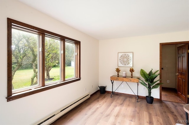 interior space featuring light hardwood / wood-style flooring and baseboard heating