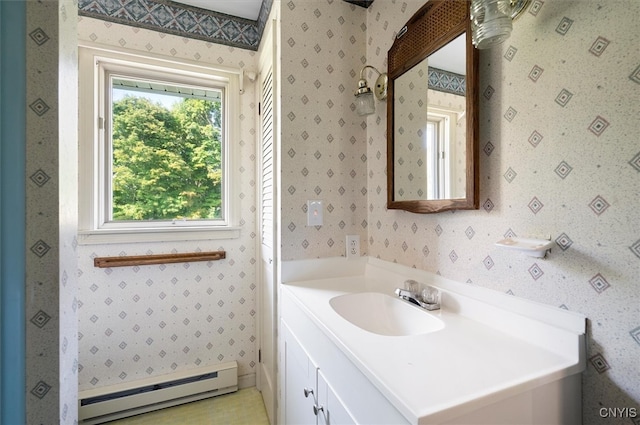 bathroom featuring vanity and baseboard heating