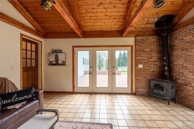 doorway to outside featuring vaulted ceiling with beams, light tile patterned flooring, a wood stove, brick wall, and wooden ceiling