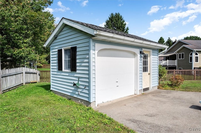 garage featuring a yard