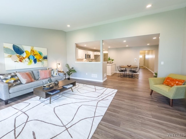 203 Carriage Ln, West Seneca, NY 14224 - living area featuring recessed lighting, wood finished floors, and baseboards