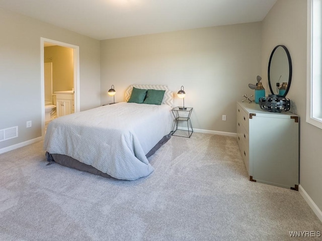 203 Carriage Ln, West Seneca, NY 14224 - bedroom featuring light colored carpet, baseboards, and ensuite bathroom