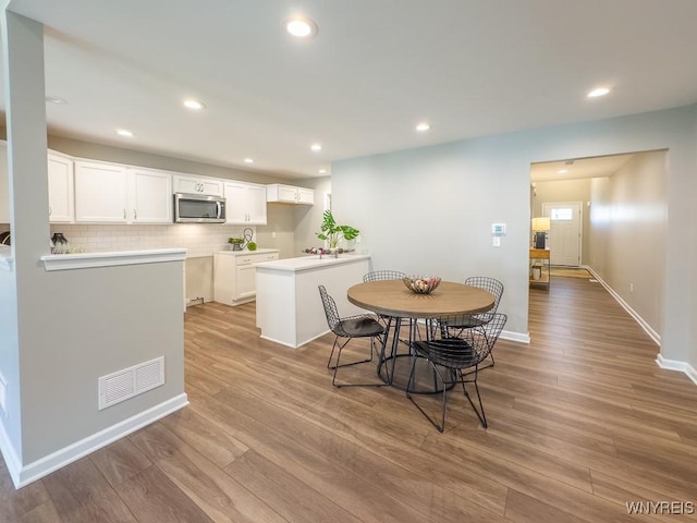 203 Carriage Ln, West Seneca, NY 14224 - dining space featuring wood finished floors, recessed lighting, and baseboards