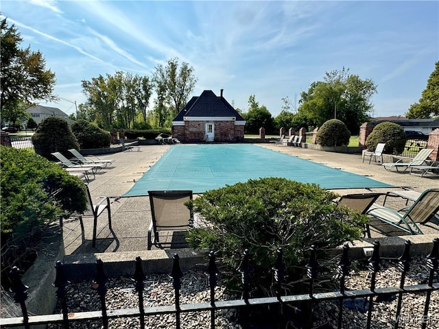 view of swimming pool with a patio