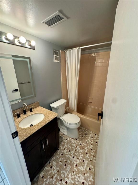 full bath with visible vents, toilet, shower / bathtub combination with curtain, and vanity