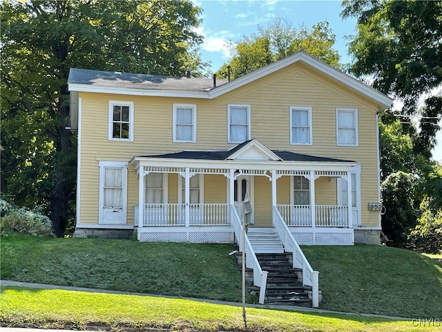 view of front of house with a front lawn and covered porch